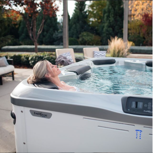 is a hot tub worth it - woman in Bullfrog Spas hot tub